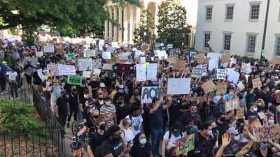 Protest on Grace heading back towards Monroe Park - peaceful, organizers speaking frequently on non-violence
