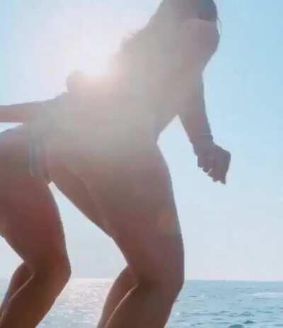 Natalie jumping off a boat