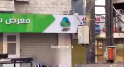 Red crescent (red cross) Palestinian medic taking active part in battle