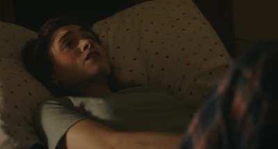 Natalia Dyer using a vibrating phone to try to get herself off