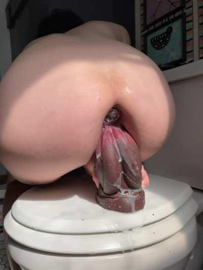 Super stuffed with a plug and a thick dildo