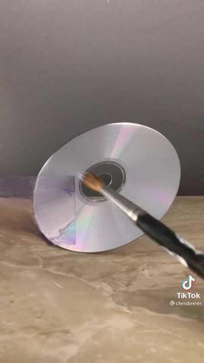 Guy colour matches a CD