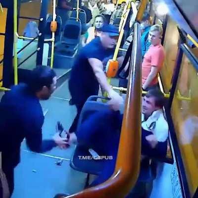 Guy punches a female conductor on a Russian bus only to get a beating and face full of mace by another passenger