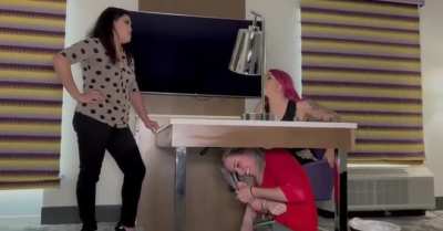 She has no idea what is going on under that desk..👅