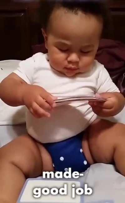 A young baby reading