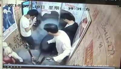 Bringing a electric scooter inside of an elevator.