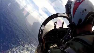 Pilot trying to land on aircraft carrier