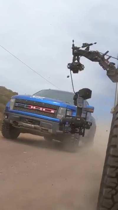 WCGW filming a truck commercial on a bumpy dirt road