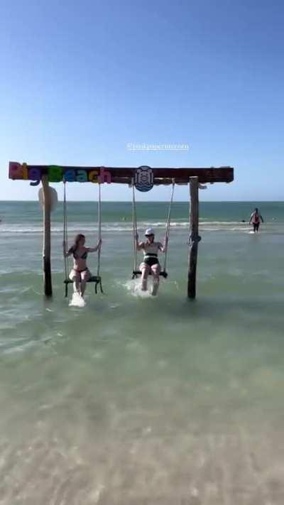 On a beach swing