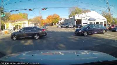 Funeral procession busting through traffic intersections without an escort.