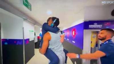 An excited coach Pozzeco jumps on Giannis arms after eliminating Serbia