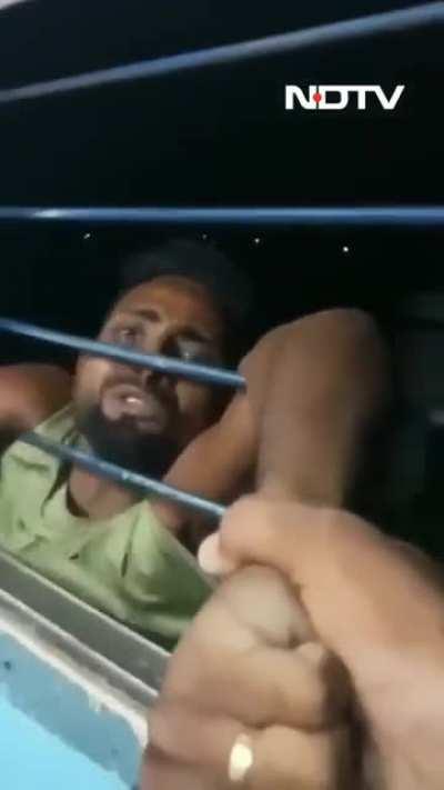 Man Hanging From Moving Train From Window