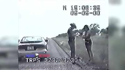 Cop asks lady to move out of the way so she doesn't get hit