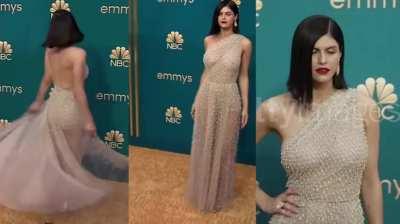 Alexandra Daddario teasing the nipples on her big tits at a premiere