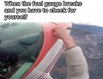 Pilot steps out onto wing of flying plane.