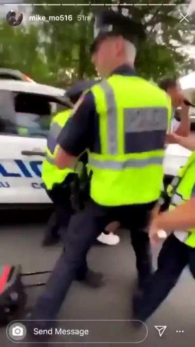 Officer purposefully stops in front of protester so they can arrest him for bumping into him