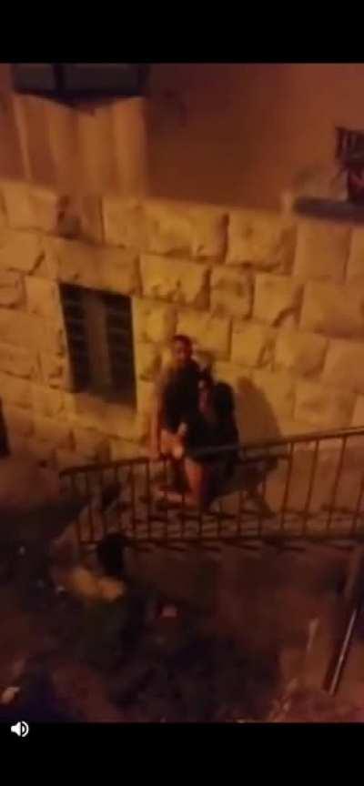 Two tourists having sex in public