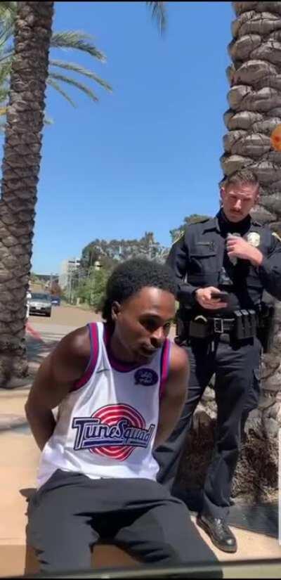 Man arrested for an 'assault on an officer' while waiting outside for his friends.