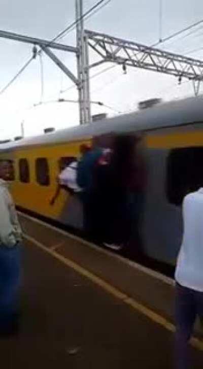 WCGW standing close to a packed train