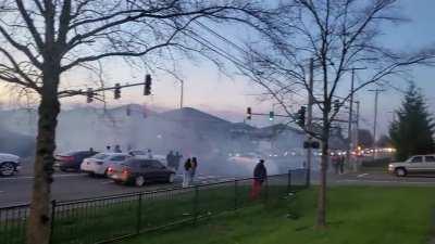 Idiots drifting in the middle of a busy intersection