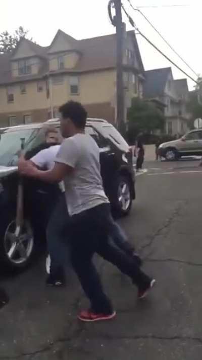 Guy brings a bat to a street fight and gets disarmed, while a cheerful ice cream truck tune plays in the background.