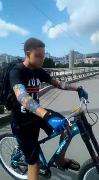 Guy's attempt to cycle down a flight of stairs ends painfully.