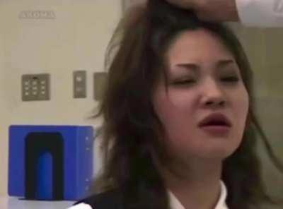 Jap Fights Off Tears Whule Enduring A Barrage of Slaps