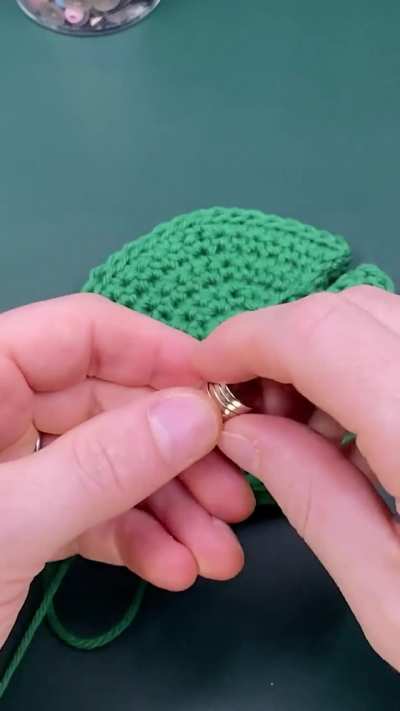 I crocheted a lily pad coaster with a magnetic water lily and frog