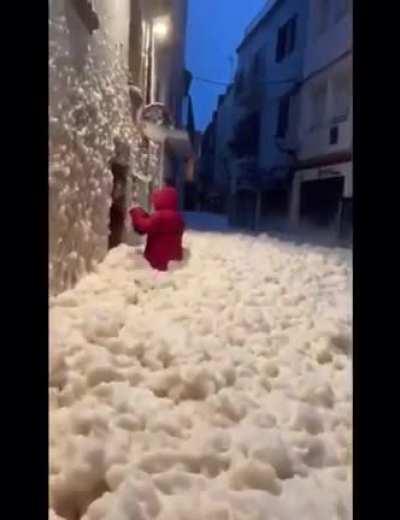 Spain filled with sea foam after a storm