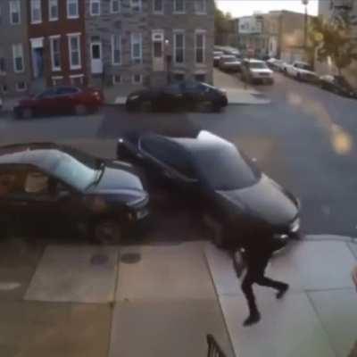 Woman attempts to run him over twice she misses and ruins her car