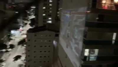 Quarantine day 20: playing Street Fighter II on a building wall