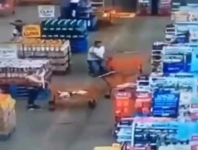 CCTV: Guy launches a shopping cart at a woman for bumping into him in line.