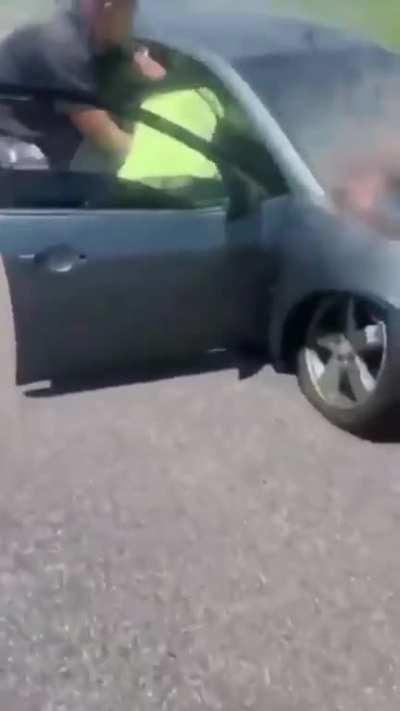Man pulls another man out of a burning exploding car