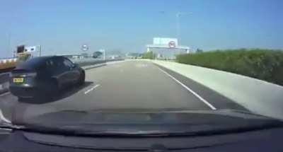 Tesla Model 3 races into a one lane construction zone