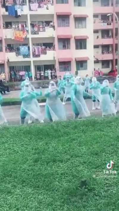 Frontliners having a bit of fun after the end of EMCO at Pangsapuri Sri Ayu