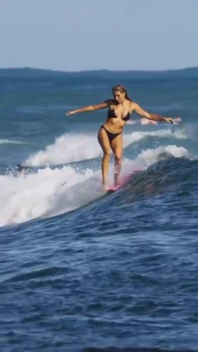 It's really amazing to see a woman on surfing how she balance and deals with the waves.