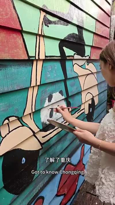 China tourist drew a panda on Penang Chew Jetty mural painting and flexed it like she did nothing wrong.