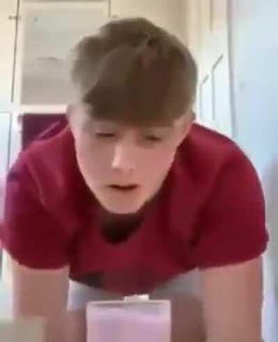 Idiot tries drinking milk with toilet paper roll