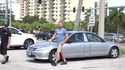 Guy protests one-sided parking ordinance