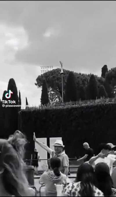 What are the people doing at the tower of Pisa?