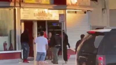 Protestors beat the hell out of female shop owner as husband pleads helplessly