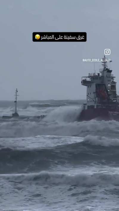 Sinking boat facing strong waves