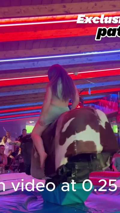 Pretty girl riding a bull in a short skirt 😍