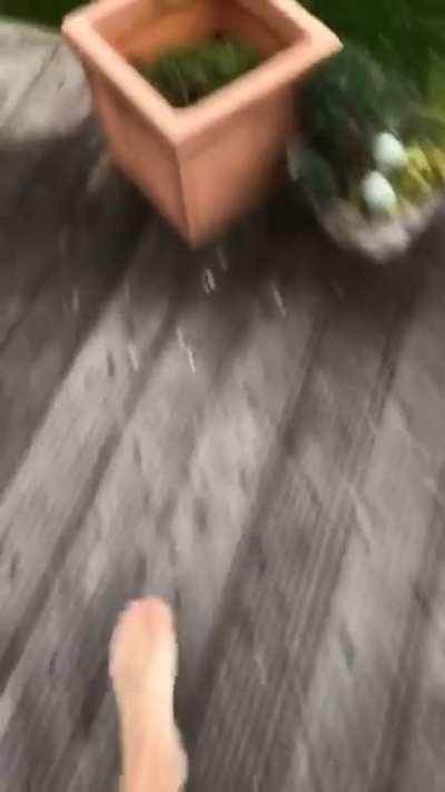 Me and my parents getting ambushed by a hail storm in the middle of a beautiful summer day