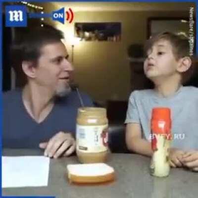 Dad teaching kids basic coding principles by letting them write a detailed instruction on how to make a PB sandwich