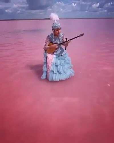 A dombra performance by a 23-year-old Kazakh musician in Lake Köbeituz, a salt lake in Kazakhstan that turns pink every several years.