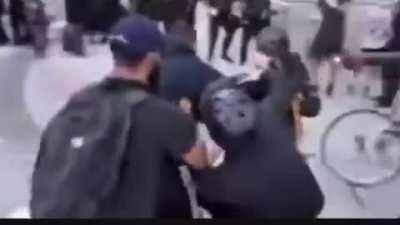 Peaceful protesters in DC tackle a rioter and hand him over to the police for trying to turn things violent. He was smashing the pavement so people could have objects to throw at the police