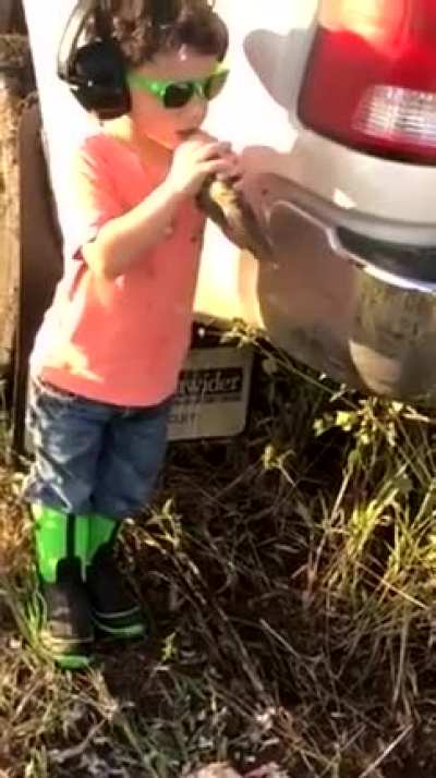 Kid bites head off of bird