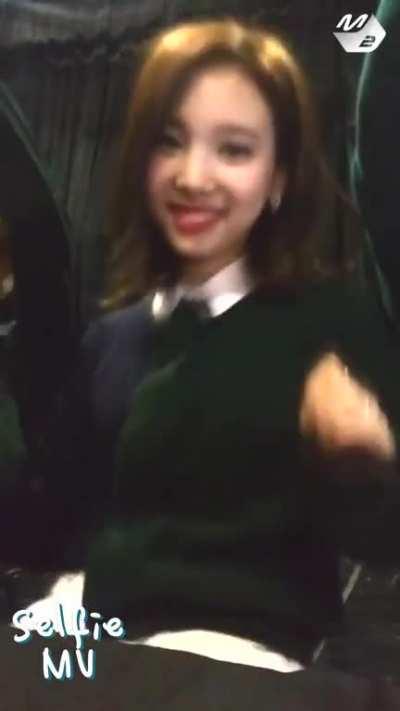 Cutie Nayeon body rolls and laugh
