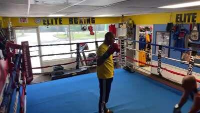 Walking into a boxing gym and challenging the trainer